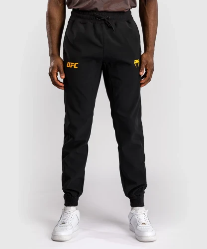 Pánské tepláky UFC Fusion by Venum Fight Week - černo/zlaté
